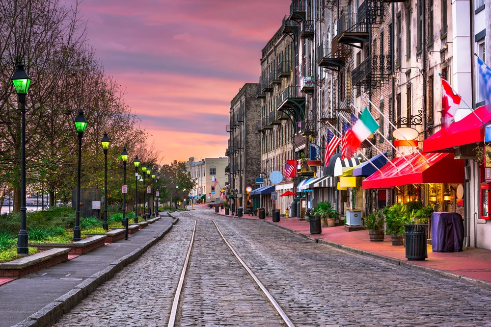 A view of downtown Georgia with lots of flags.