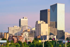A ferries wheel and buildings in the city of Georgia